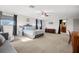 Main bedroom with carpeted floor, ensuite bathroom and sitting area at 2781 Westchester Dr S, Clearwater, FL 33761