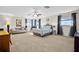 Large main bedroom with carpeted floors and ensuite bathroom at 2781 Westchester Dr S, Clearwater, FL 33761