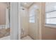 Updated shower with glass enclosure and tile surround at 2781 Westchester Dr S, Clearwater, FL 33761