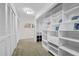 Bright walk-in closet with built-in shelving and storage at 2781 Westchester Dr S, Clearwater, FL 33761