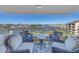 Enjoy breathtaking water views from this relaxing balcony, complete with comfortable seating at 2795 Kipps Colony S Dr # 305, St Petersburg, FL 33707