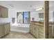 Elegant bathroom with granite countertop, soaking tub, and large window at 2795 Kipps Colony S Dr # 305, St Petersburg, FL 33707