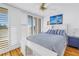 Spacious bedroom with hardwood floors and white shutters at 2795 Kipps Colony S Dr # 305, St Petersburg, FL 33707