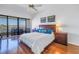 Bedroom with hardwood floors, water views, and ceiling fan at 2795 Kipps Colony S Dr # 305, St Petersburg, FL 33707