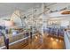 Open concept dining room with spiral staircase and hardwood floors at 2795 Kipps Colony S Dr # 305, St Petersburg, FL 33707