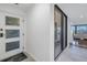 Condo entry with glass door and view to living area at 2795 Kipps Colony S Dr # 305, St Petersburg, FL 33707