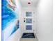Bright entryway with unique door and artwork at 2795 Kipps Colony S Dr # 305, St Petersburg, FL 33707