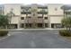 Building exterior showcasing landscaping and parking at 2795 Kipps Colony S Dr # 305, St Petersburg, FL 33707