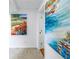 Hallway with two large pieces of art at 2795 Kipps Colony S Dr # 305, St Petersburg, FL 33707