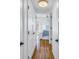 Bright hallway with hardwood floors and white doors at 2795 Kipps Colony S Dr # 305, St Petersburg, FL 33707