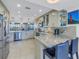 Modern kitchen with granite countertops and breakfast bar at 2795 Kipps Colony S Dr # 305, St Petersburg, FL 33707