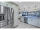 Stainless steel appliances and granite countertops in this updated kitchen at 2795 Kipps Colony S Dr # 305, St Petersburg, FL 33707