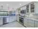 Modern kitchen with granite counters and breakfast bar at 2795 Kipps Colony S Dr # 305, St Petersburg, FL 33707