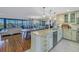 Open concept kitchen with granite island and hardwood floors at 2795 Kipps Colony S Dr # 305, St Petersburg, FL 33707
