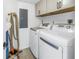 Laundry room with washer, dryer, and storage at 2795 Kipps Colony S Dr # 305, St Petersburg, FL 33707