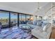 Spacious living room with water views and spiral staircase at 2795 Kipps Colony S Dr # 305, St Petersburg, FL 33707