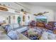 Relaxing living room featuring a large TV and comfortable seating at 2795 Kipps Colony S Dr # 305, St Petersburg, FL 33707