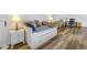 Upstairs loft with daybed, workspace, and hardwood floors at 2795 Kipps Colony S Dr # 305, St Petersburg, FL 33707