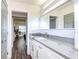 Modern bathroom with gray countertop and walk-in shower at 300 Venetian Dr # 7, Clearwater, FL 33755