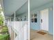 Clean and bright hallway with white railings and doors at 300 Venetian Dr # 7, Clearwater, FL 33755