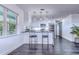 Modern kitchen with island, stainless steel appliances, and white cabinets at 300 Venetian Dr # 7, Clearwater, FL 33755