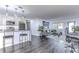 Open concept living area with gray sofa and home office at 300 Venetian Dr # 7, Clearwater, FL 33755