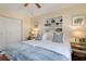 Bright bedroom with twin beds, built-in shelving, and ample natural light at 3116 Winchester Dr, Dunedin, FL 34698
