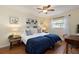 Twin bedroom with built-in shelves and window at 3116 Winchester Dr, Dunedin, FL 34698