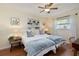 Twin bedroom with sunflowers decor and built-in shelves at 3116 Winchester Dr, Dunedin, FL 34698