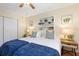 Twin bedroom with built-in shelves and window at 3116 Winchester Dr, Dunedin, FL 34698
