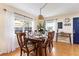 Charming dining room featuring a wood table and cork flooring at 3116 Winchester Dr, Dunedin, FL 34698
