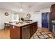 Modern kitchen with granite countertops and stainless steel appliances at 3116 Winchester Dr, Dunedin, FL 34698