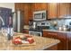 Granite kitchen counter with wine, cheese and fruit platter at 3116 Winchester Dr, Dunedin, FL 34698