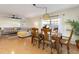 Bright living room with L-shaped sofa and cork flooring at 3116 Winchester Dr, Dunedin, FL 34698