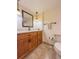 Bathroom with wood vanity, quartz countertop, and tile flooring at 4013 Lexington Ct, Largo, FL 33771