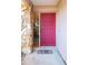 Red front door with sidelight and stone accents at 4013 Lexington Ct, Largo, FL 33771