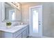 Bathroom with vanity, sink, and exterior access at 4909 Willow Ridge Ter, Valrico, FL 33596