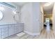 Bathroom with double vanity and a view into bedroom at 4909 Willow Ridge Ter, Valrico, FL 33596