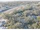 Aerial view of property highlighting its wooded surroundings at 4918 Woodland Dr, St Petersburg, FL 33708