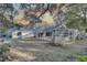 Spacious backyard with a screened enclosure at 4918 Woodland Dr, St Petersburg, FL 33708