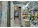 Bathroom with vanity, toilet and shower, plus access to bedroom at 4918 Woodland Dr, St Petersburg, FL 33708