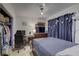 Cozy bedroom with a double bed, dresser, and closet at 4918 Woodland Dr, St Petersburg, FL 33708