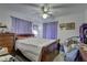 Bright bedroom featuring a queen-size bed and ample closet space at 4918 Woodland Dr, St Petersburg, FL 33708