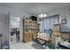 Small dining area, wooden cabinet, and seating area at 4918 Woodland Dr, St Petersburg, FL 33708