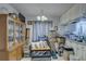 Cozy dining area with a wooden cabinet and seating at 4918 Woodland Dr, St Petersburg, FL 33708
