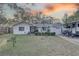 Front view of the house with a well-maintained lawn at 4918 Woodland Dr, St Petersburg, FL 33708