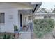Front porch with rocking chairs and potted plants at 4918 Woodland Dr, St Petersburg, FL 33708