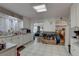 Bright eat-in kitchen with white cabinets and tile floors at 4918 Woodland Dr, St Petersburg, FL 33708