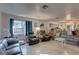 Living room with comfortable seating and large windows at 4918 Woodland Dr, St Petersburg, FL 33708
