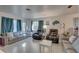 Bright and airy living room with teal curtains at 4918 Woodland Dr, St Petersburg, FL 33708